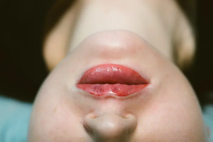Permanent make-up: a healed lip blush, colour carried to the border without a hard line.